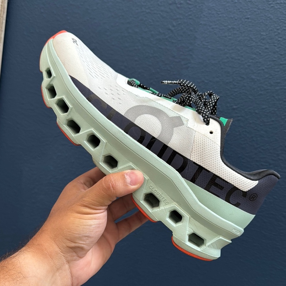 On Running Cloudtec Shoes in White and Black with Green Accents